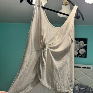 Cream tank top with twist in back